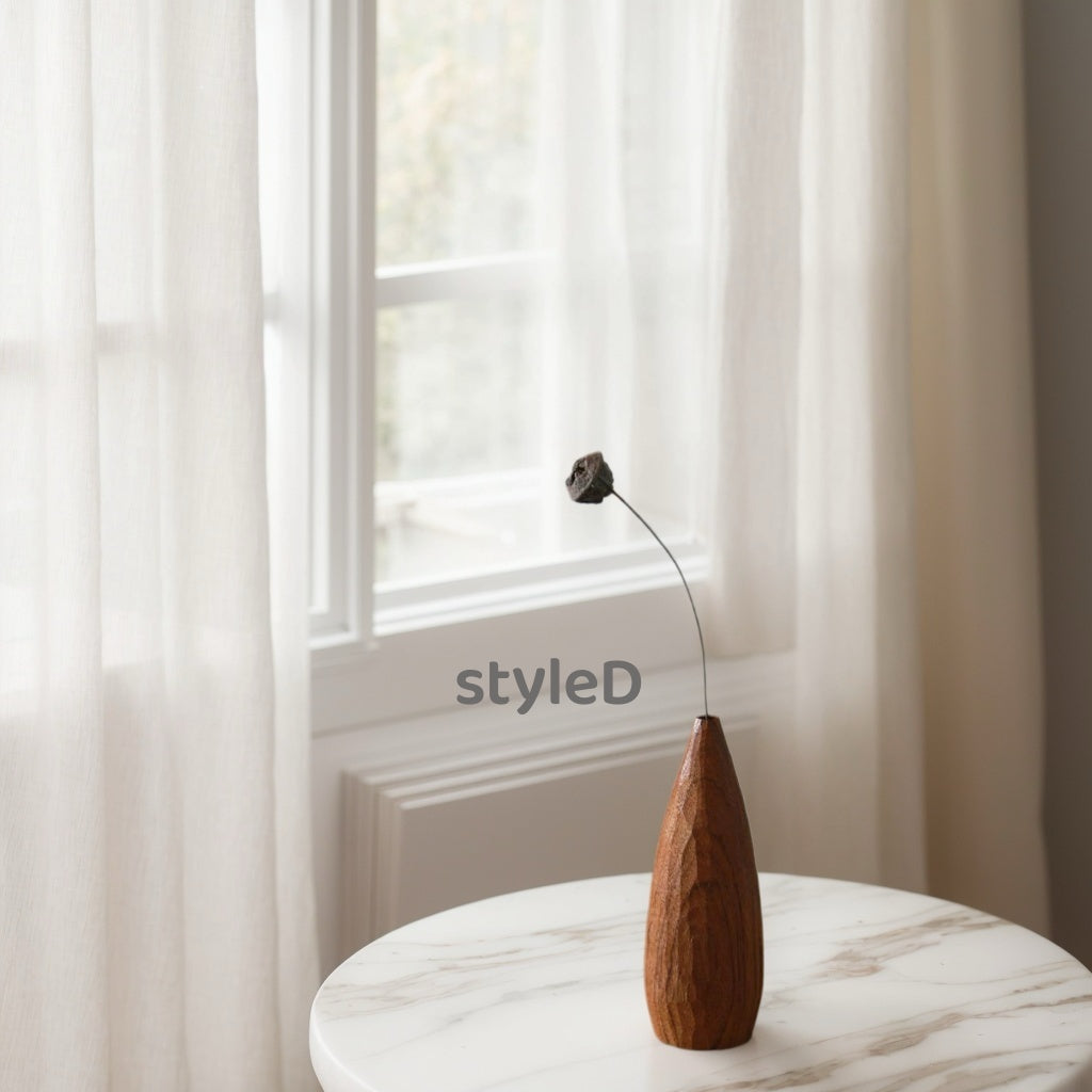 Crafted from premium Burmese Teak and meticulously hand-carved by skilled artisans, this small decorative vase combines timeless elegance with functional design. Ideal for displaying fresh blooms, dried floral arrangements, or as a standalone decorative accent, it adds a touch of rustic charm to any space while meeting modern sustainability standards
