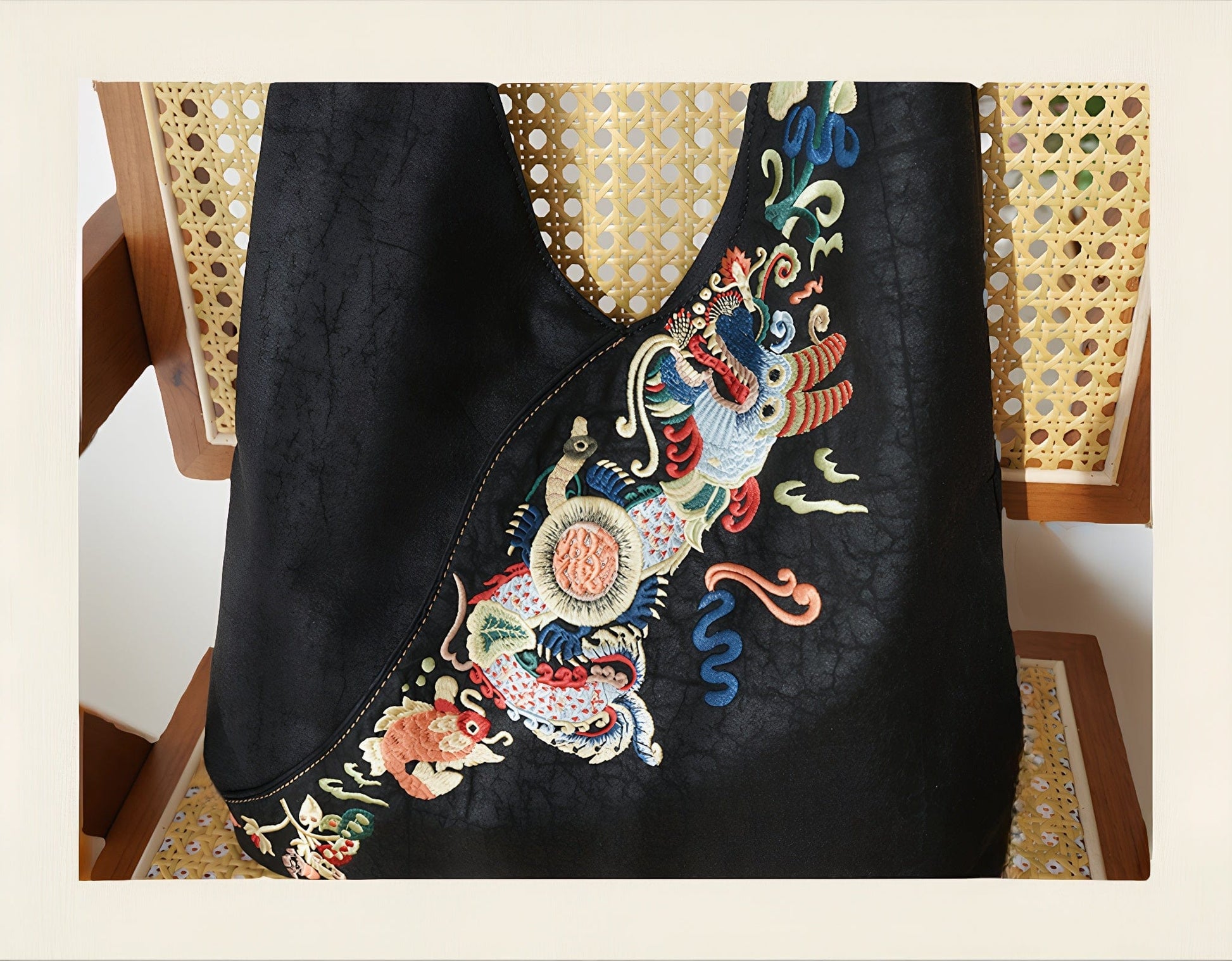 Luxury hand-embroidered 'Carp Leaping Loong Gate' pattern on the Loong Li Xiangyunsha shoulder bag, a symbol of success and good fortune in New Chinese style.