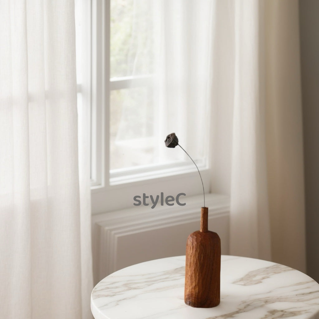 Crafted from ​premium Burmese Teak​ and meticulously hand-carved by skilled artisans, this small decorative vase combines timeless elegance with functional design. Ideal for displaying fresh blooms, dried floral arrangements, or as a standalone decorative accent, it adds a touch of rustic charm to any space while meeting modern sustainability standards