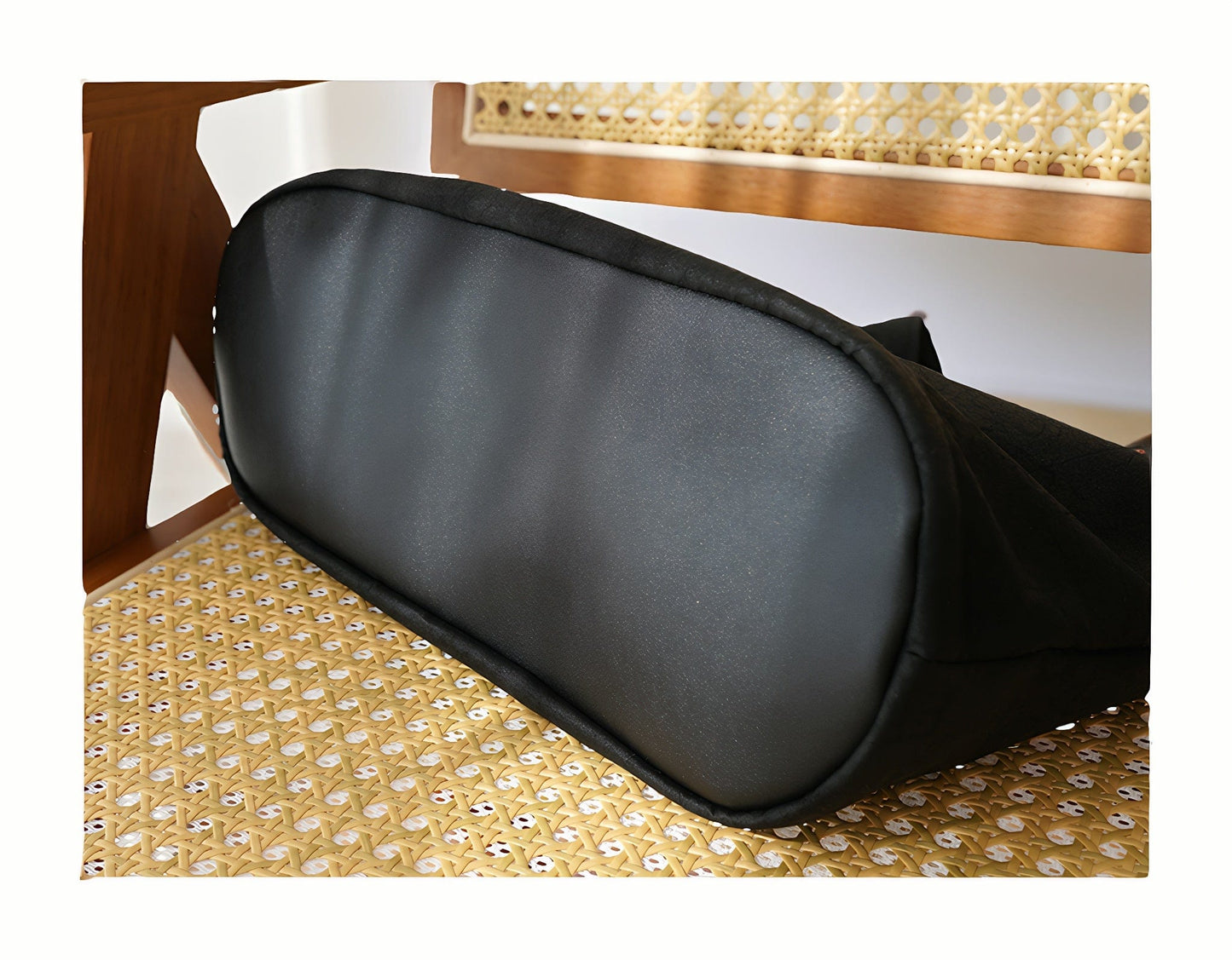 Detailed view of the bottom of the Loong Li tote bag, highlighting the structured base, reinforced stitching, and the unique texture of the Xiangyunsha fabric from below.