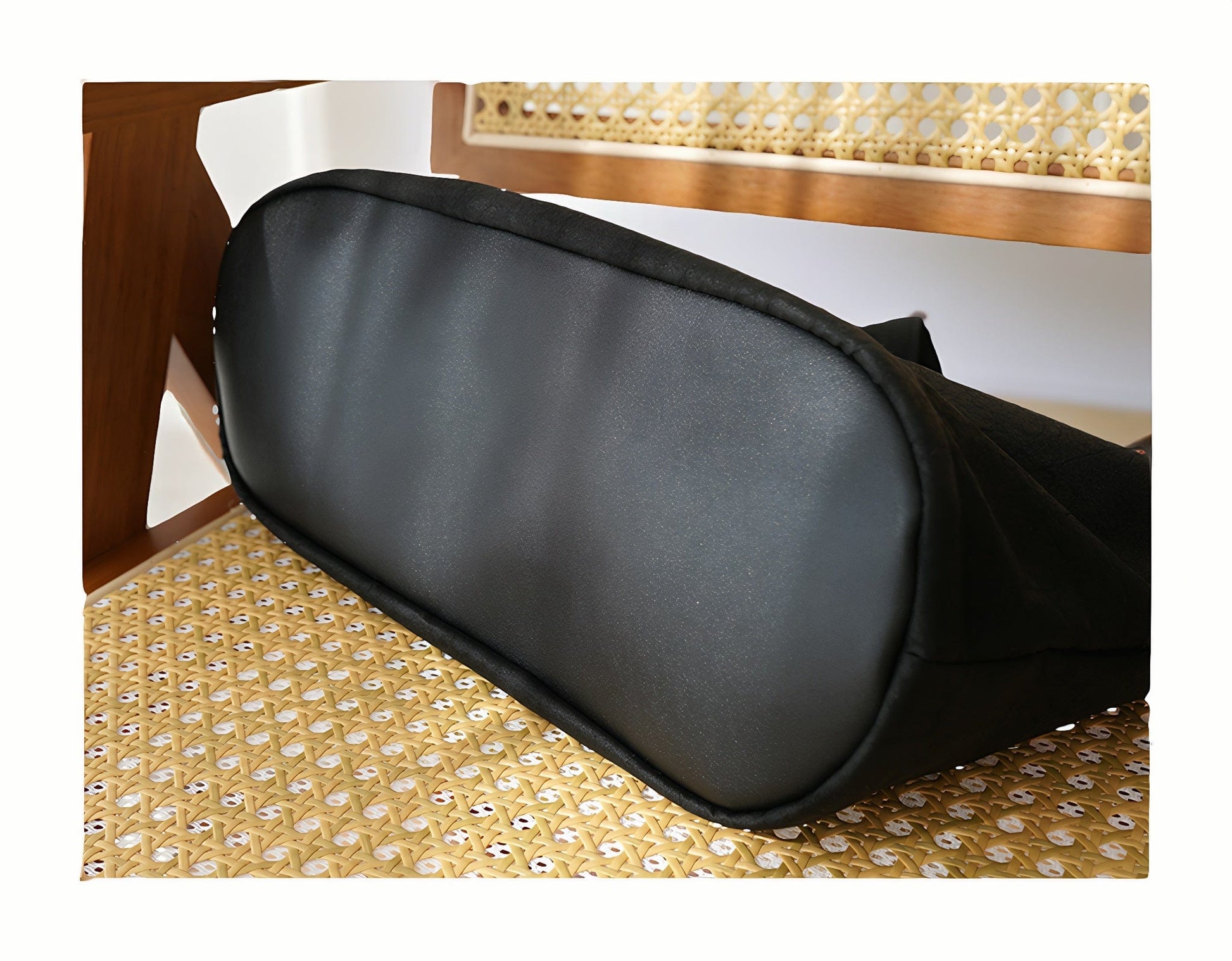 Detailed view of the bottom of the Loong Li tote bag, highlighting the structured base, reinforced stitching, and the unique texture of the Xiangyunsha fabric from below.