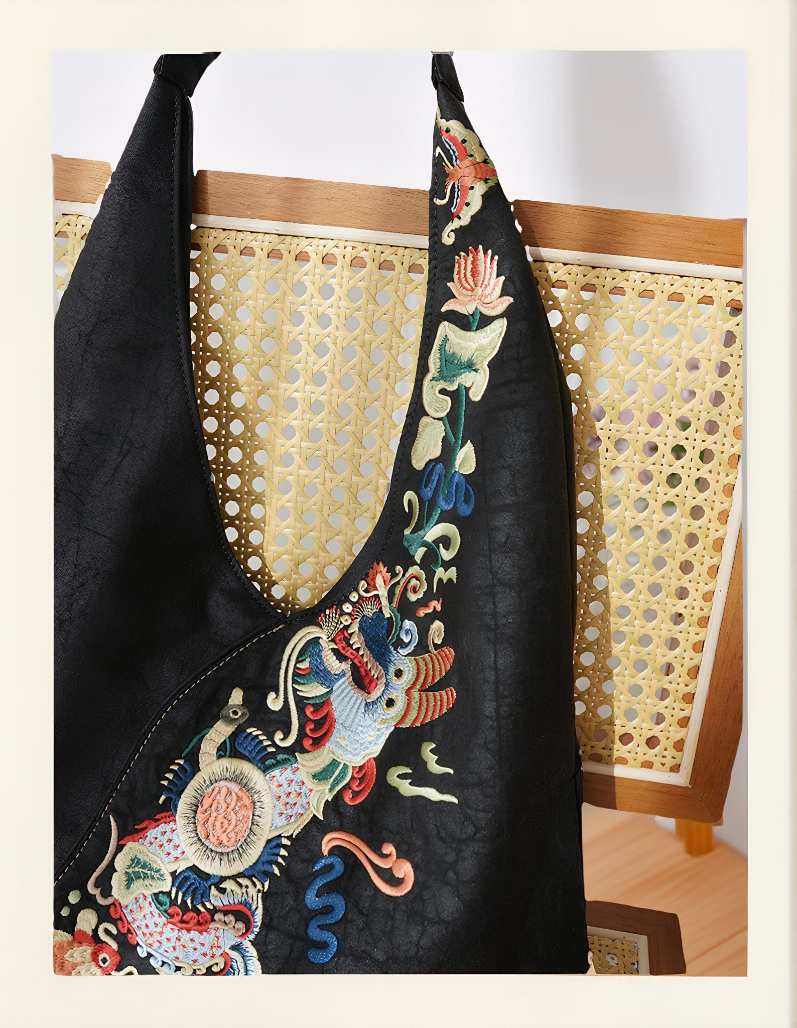 Luxury hand-embroidered 'Carp Leaping Loong Gate' pattern on the Loong Li Xiangyunsha shoulder bag, a symbol of success and good fortune in New Chinese style.
