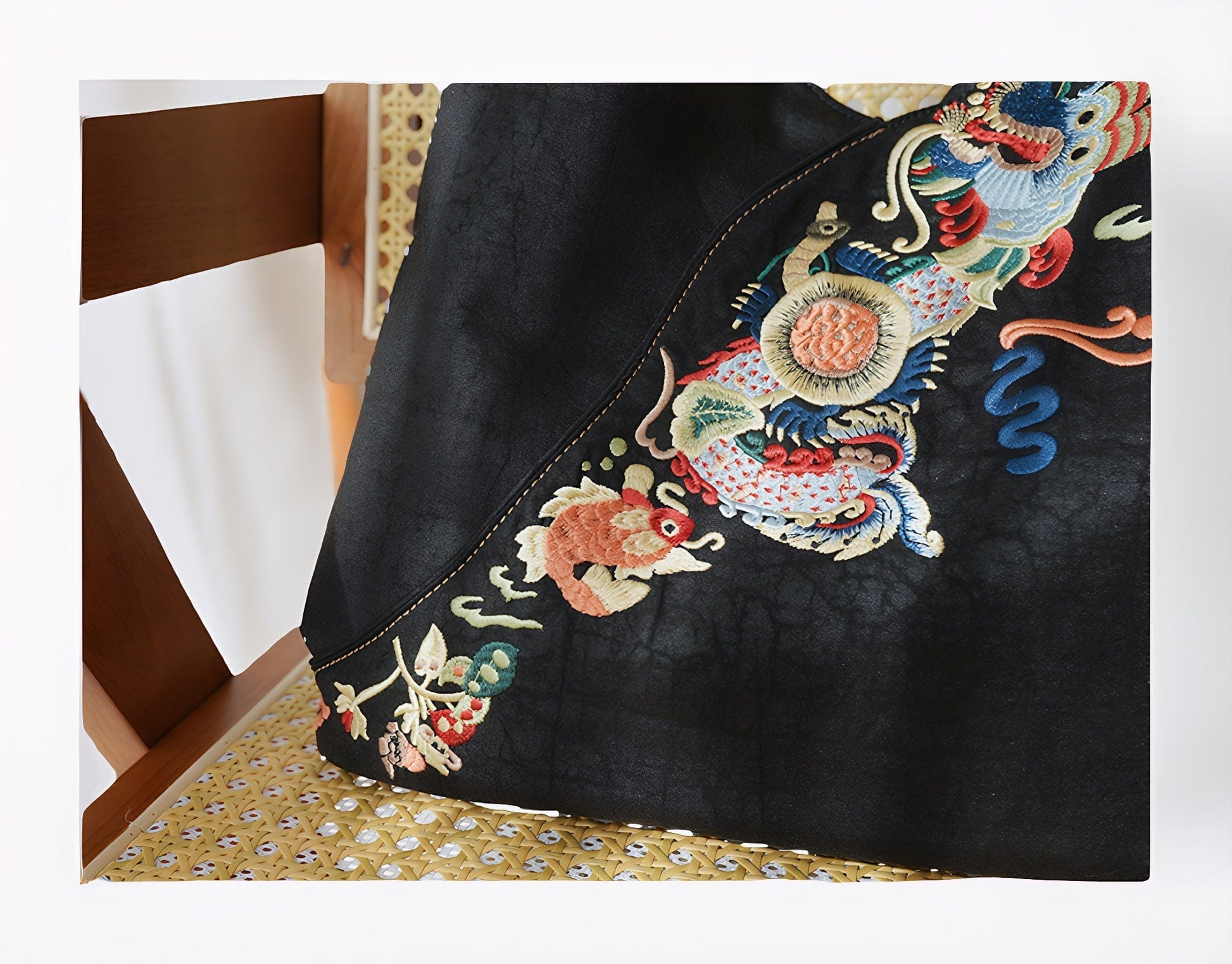 Luxury hand-embroidered 'Carp Leaping Loong Gate' pattern on the Loong Li Xiangyunsha shoulder bag, unique designa,a symbol of success and good fortune in New Chinese style.
