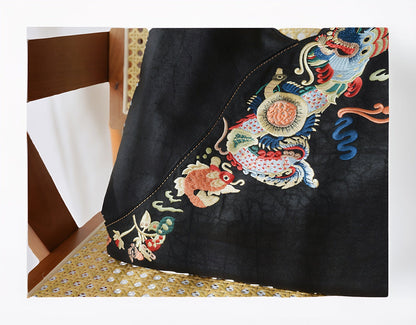 Luxury hand-embroidered 'Carp Leaping Loong Gate' pattern on the Loong Li Xiangyunsha shoulder bag, unique designa,a symbol of success and good fortune in New Chinese style.